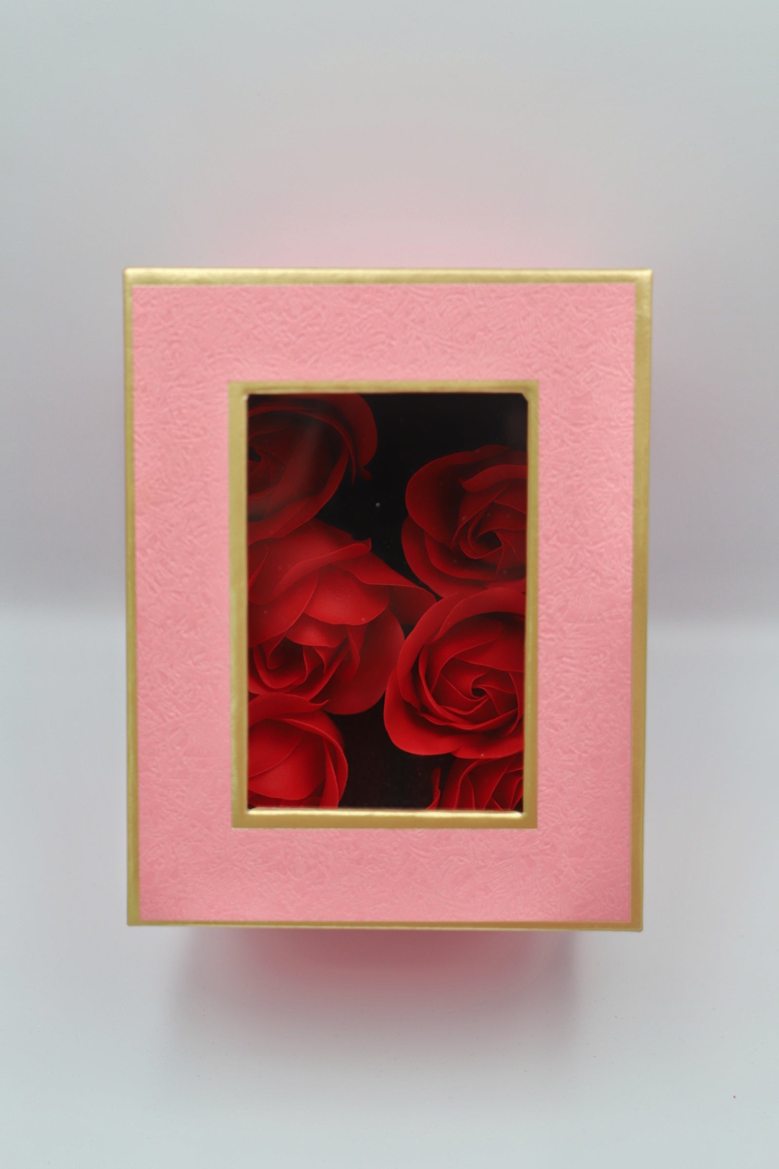 Pink gift box red petals