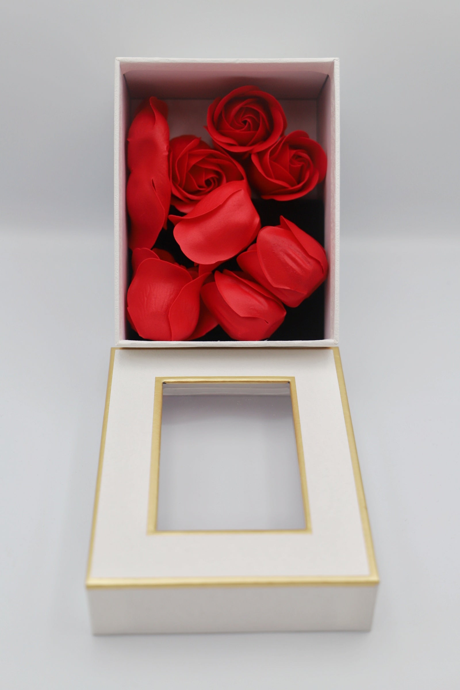 White gift box red petals